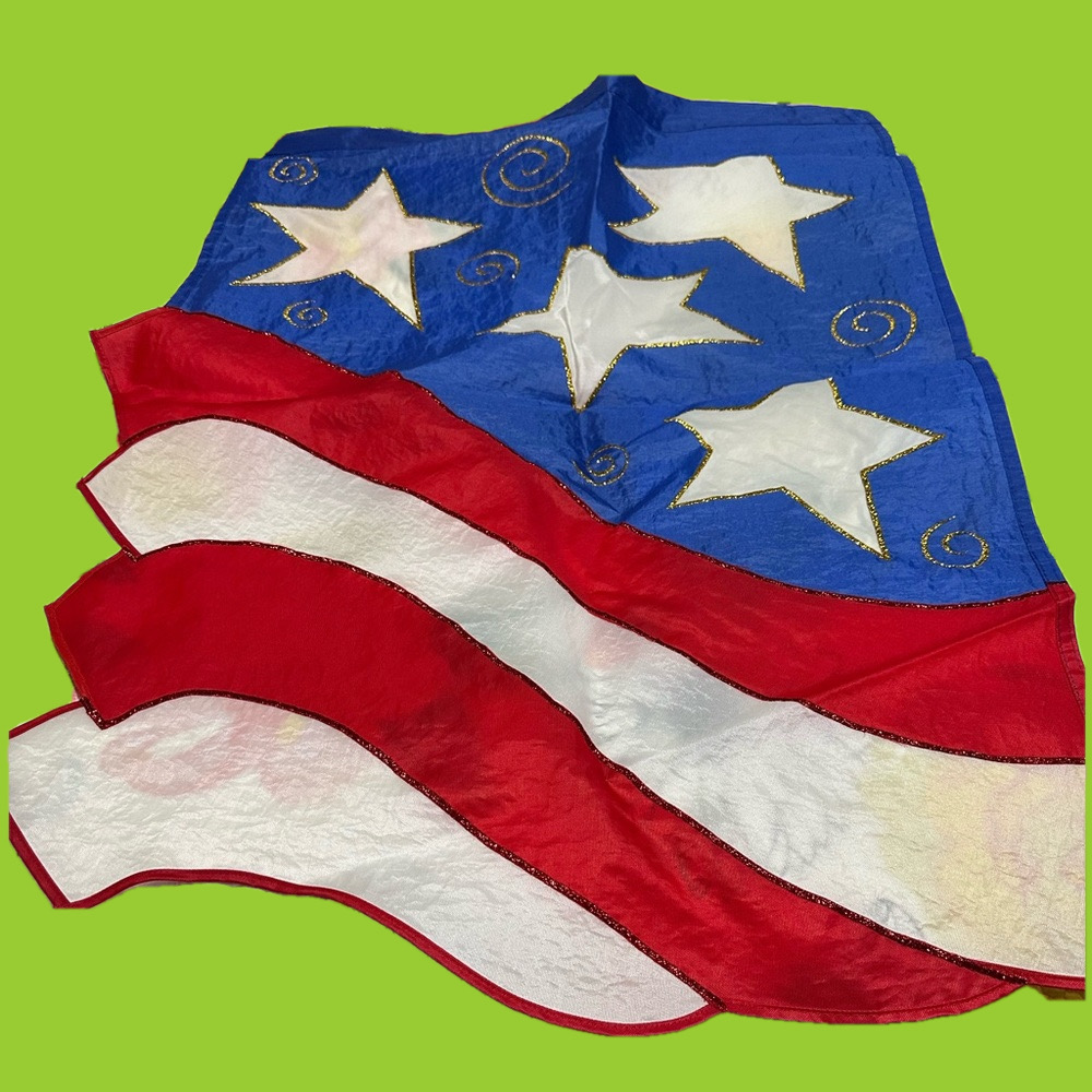 Celebrate America with this red, white & blue flag! Flag measures 29” x 42”.